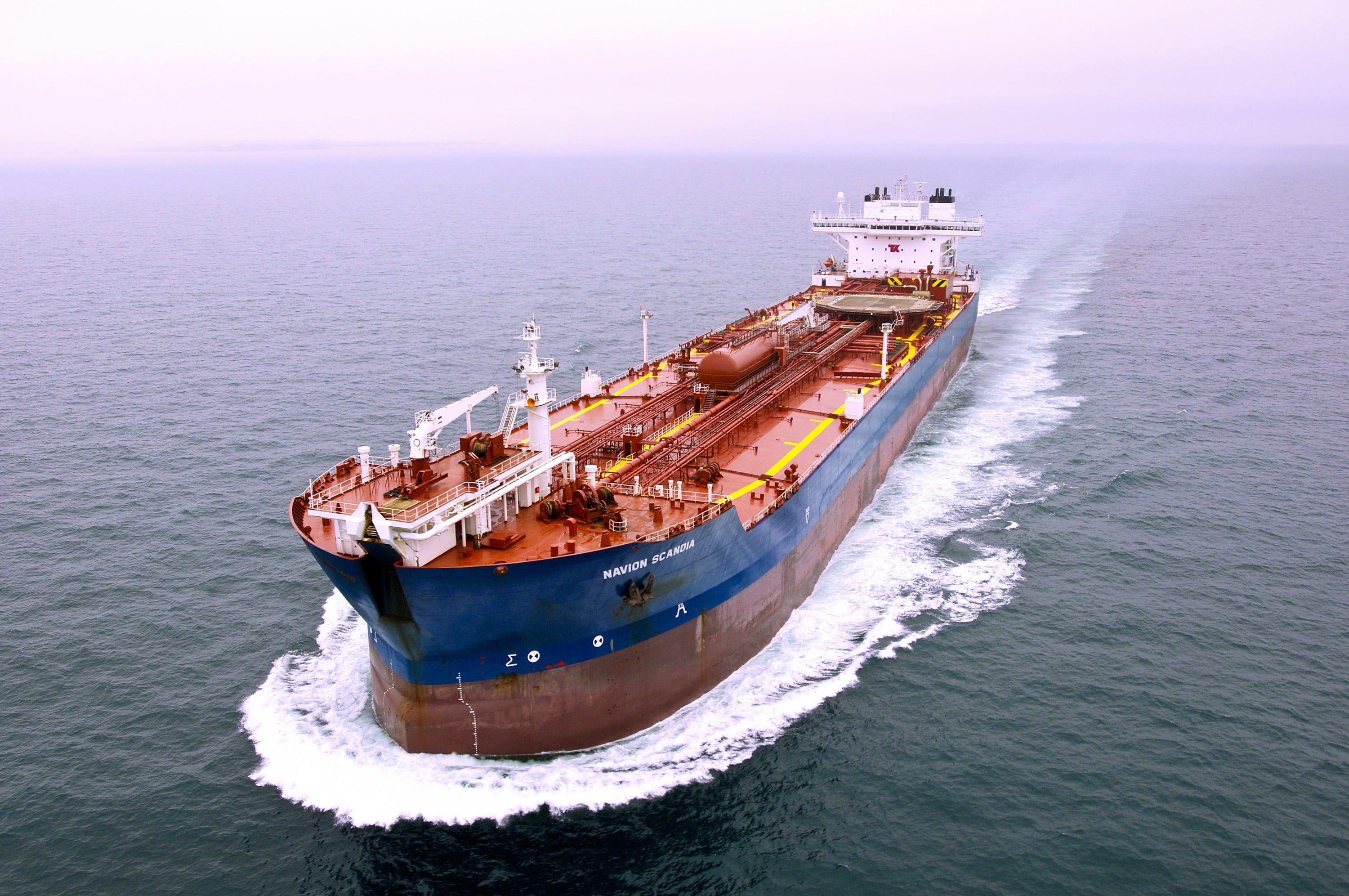 A photo shows a shuttle tanker vessel motoring at high speed in relatively calm seas