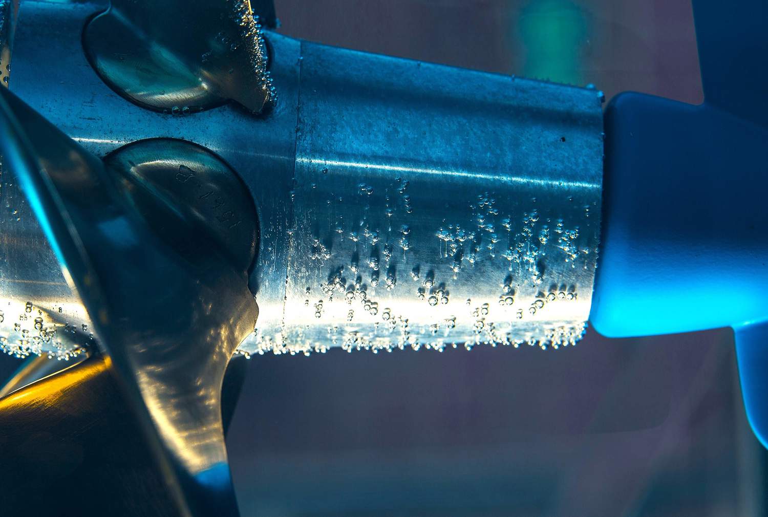 A close up image of a test propeller shows cavitation bubbles