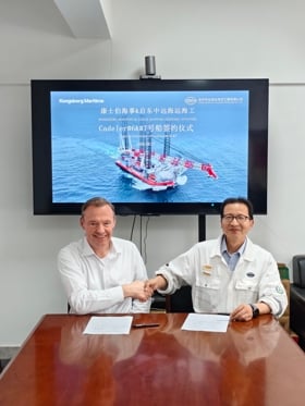 Representatives from Kongsberg Maritime and COSCO Shipping Offshore during a vessel signing ceremony for Cadeler newbuild projects.